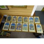 Twelve gilt framed prints depicting the various signs of the zodiac above historical scenes with