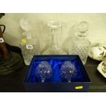 Glass ship's style decanter and two others and a pair of Bohemia crystal boxed brandy glasses