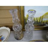 Two cut glass thistle shaped decanters with stoppers