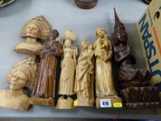 Collection of carved wooden figurines and busts