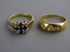 Two eighteen carat gold diamond set rings, one with central blue stone cross, size 'K', the other