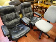 Pair of black upholstered easy chairs with elbow pads and a grey upholstered office chair