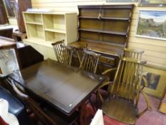 Predominantly Ercol dining suite of dresser and a draw leaf table with six (four plus two) dining