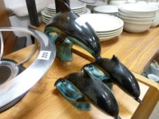 Three Poole pottery dolphins