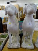 Pair of reconstituted stone seated dog garden ornaments