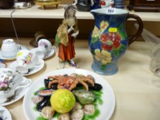 Continental figurine, Royal Doulton floral decorated jug and a seafood decorated plate