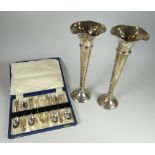 A pair of hallmarked silver trumpet vases together with a cased set of EPNS spoons