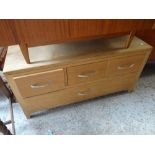 A 1960s teak G-Plan style ottoman / storage unit together with a light oak four-drawer base coffee
