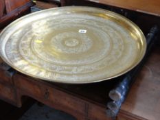 A polished brass Eastern decorated bernares table