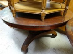 An antique mahogany rosewood veneered circular dining / breakfast table