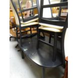 A modern black ash dining table & four matching chairs