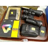 Pair of Tasco binoculars, vintage cameras, mobile phone