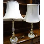 A pair of onyx & brass effect table lamps