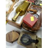 A boxed brass compass together with two leather cased military campuses, vintage camera etc
