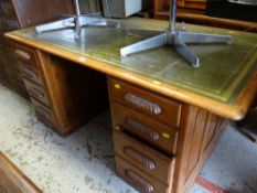 Large vintage light oak green leather tooled top desk with flanking drawers