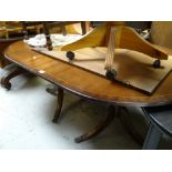 A reproduction mahogany Georgian-style extending dining table