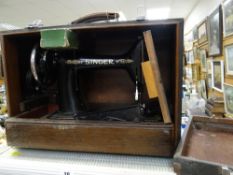 A rigid cased Singer sewing machine