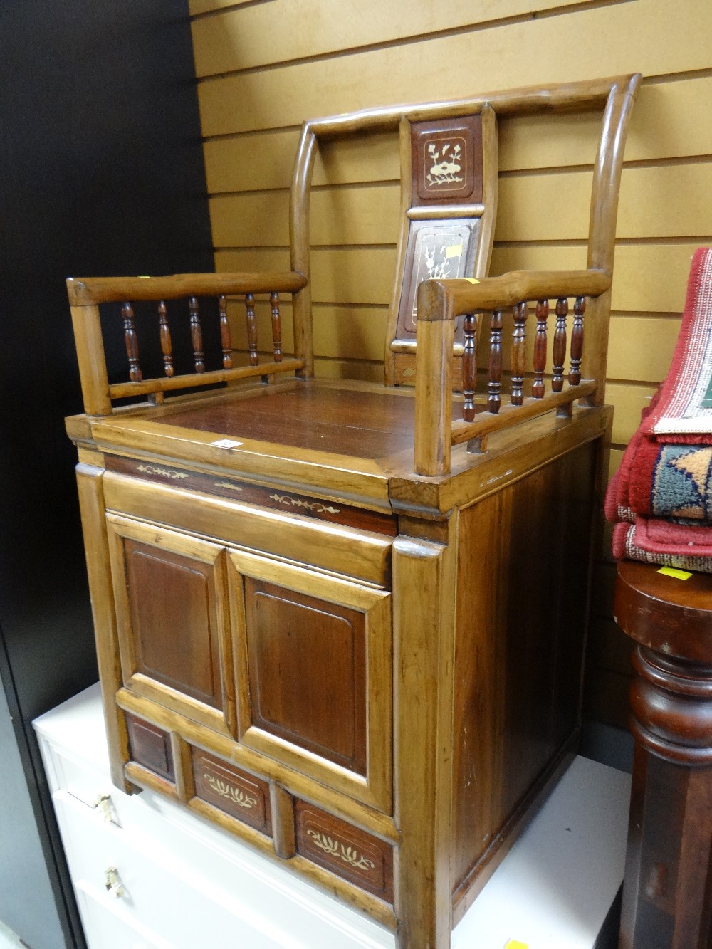 An Oriental inlaid hardwood decorated storage seat