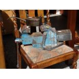 A vintage bench vice together with a vintage Browns Iron Mongers of Cardiff oil can