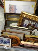 A crate of various framed prints, pictures