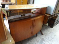 A 1960s teak G-Plan style bow fronted cocktail cabinet