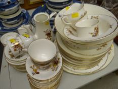 A parcel of Royal Worcester brown & gilt harvest-style patterned tea & dinnerware