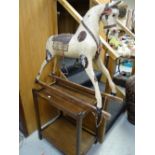 A vintage wooden child's rocking horse together with an oak tea trolley