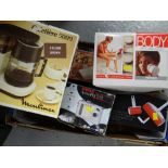 Box of various household items, coffee filter, camera, body massager etc