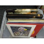 A box of mainly The Times reference books, quantity of mainly jazz LP records