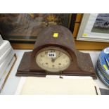 A vintage mahogany dome top mantel clock
