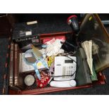 Crate of miscellaneous items including a Phillips heat lamp, rechargeable torch, books etc