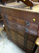 A large antique oak seven-drawer document / plan chest with lifting top & Art Nouveau-style metal