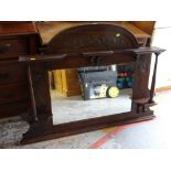 Vintage mahogany overmantel mirror with carved decoration to the top