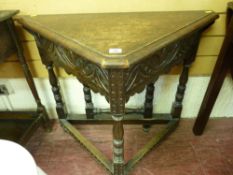 Triangular shaped carved and polished hall table
