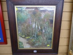 Oak framed watercolour study of a cottage garden, indistinctly signed