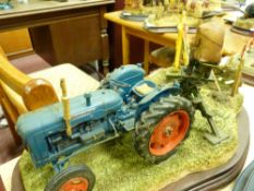 Border Fine Arts model of a farmer at work with blue tractor, sculptor Ayres, no certificate