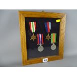 Cased group of four World War II medals (appear unmarked where visible)