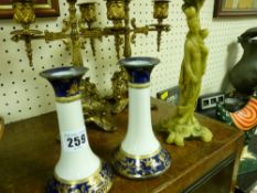 Pair of Noritake cobalt blue and gilt candleholders and a resin candleholder