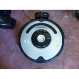 iRobot Roomba remote vacuum cleaner with charger and instructions E/T