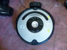 iRobot Roomba remote vacuum cleaner with charger and instructions E/T