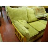 Light wood and sand coloured upholstered three seater sofa