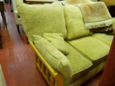 Light wood and sand coloured upholstered three seater sofa