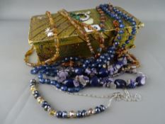 Vintage box containing a quantity of bead necklaces