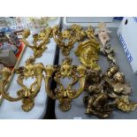 Four Rococo style double candle wall sconces, a collection of cherubic style ornaments etc