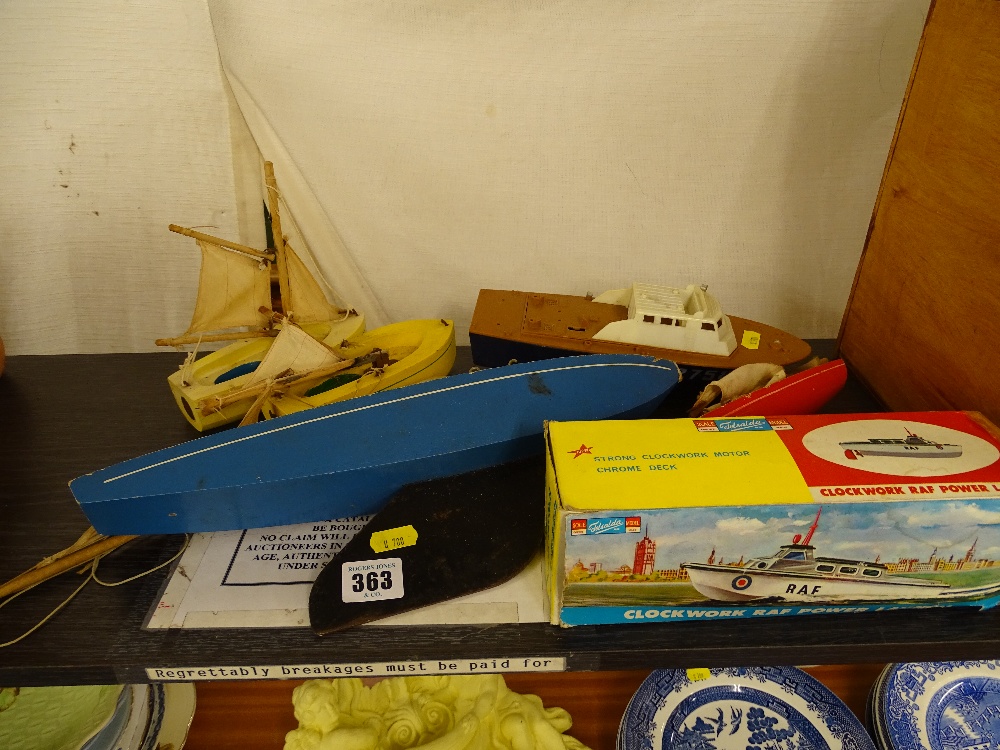 Small collection of model boats including a boxed clockwork power launch