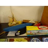 Small collection of model boats including a boxed clockwork power launch