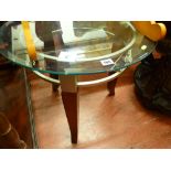 Glass topped circular coffee table