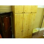 Excellent modern light wood effect three door wardrobe with base drawers and upper cupboard