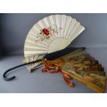 Three vintage face fans including a bone example with woven silkwork decoration along with a vintage