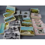 Collection of vintage postcards contained in two boxes, predominantly unused local North Wales